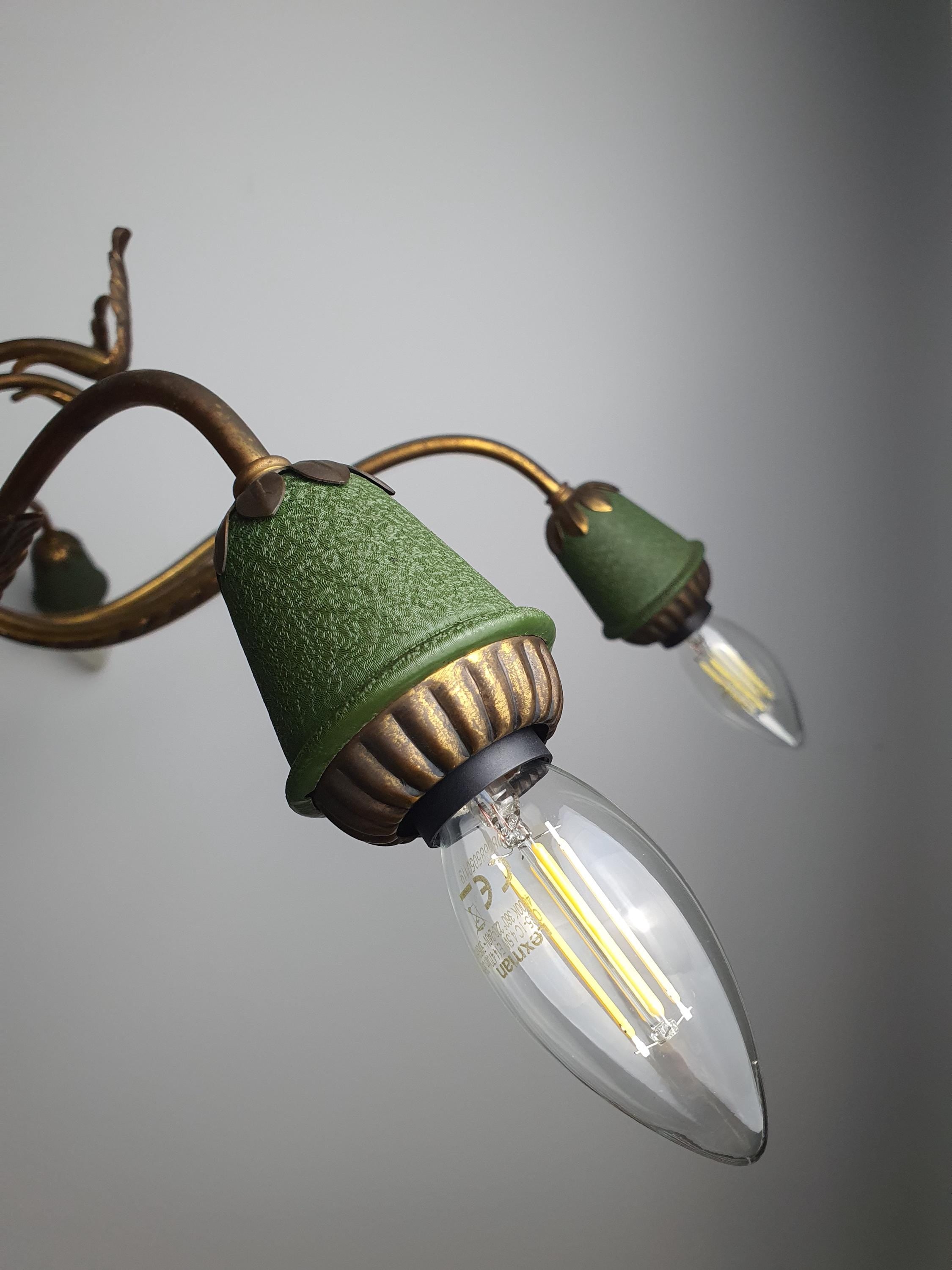 Close-up of green decorative accents on vintage 1950s Italian 8-arm Sputnik chandelier, brass bronze green contrast detail