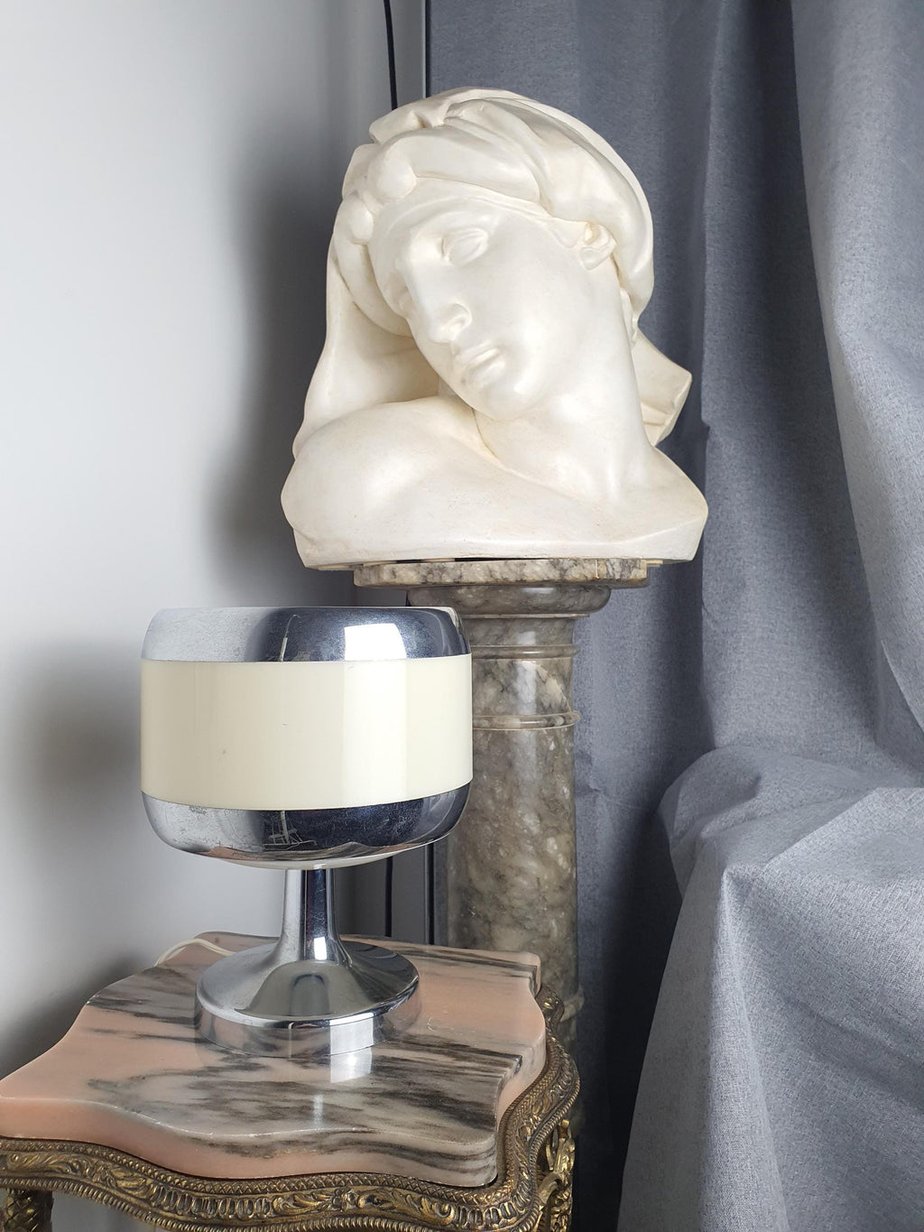 Vintage 1970s Italian Space Age table lamp on desk, compact beige chrome PMMA form, retro Scandinavian minimalist interior