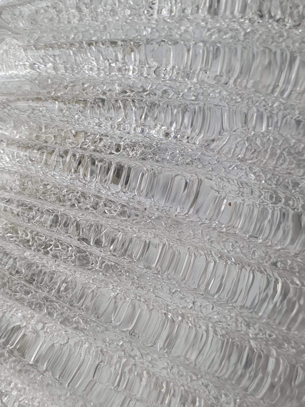 Close-up of ribbed relief pattern on vintage Venetian glass shell flush mount, smooth and glass-sand dual finish