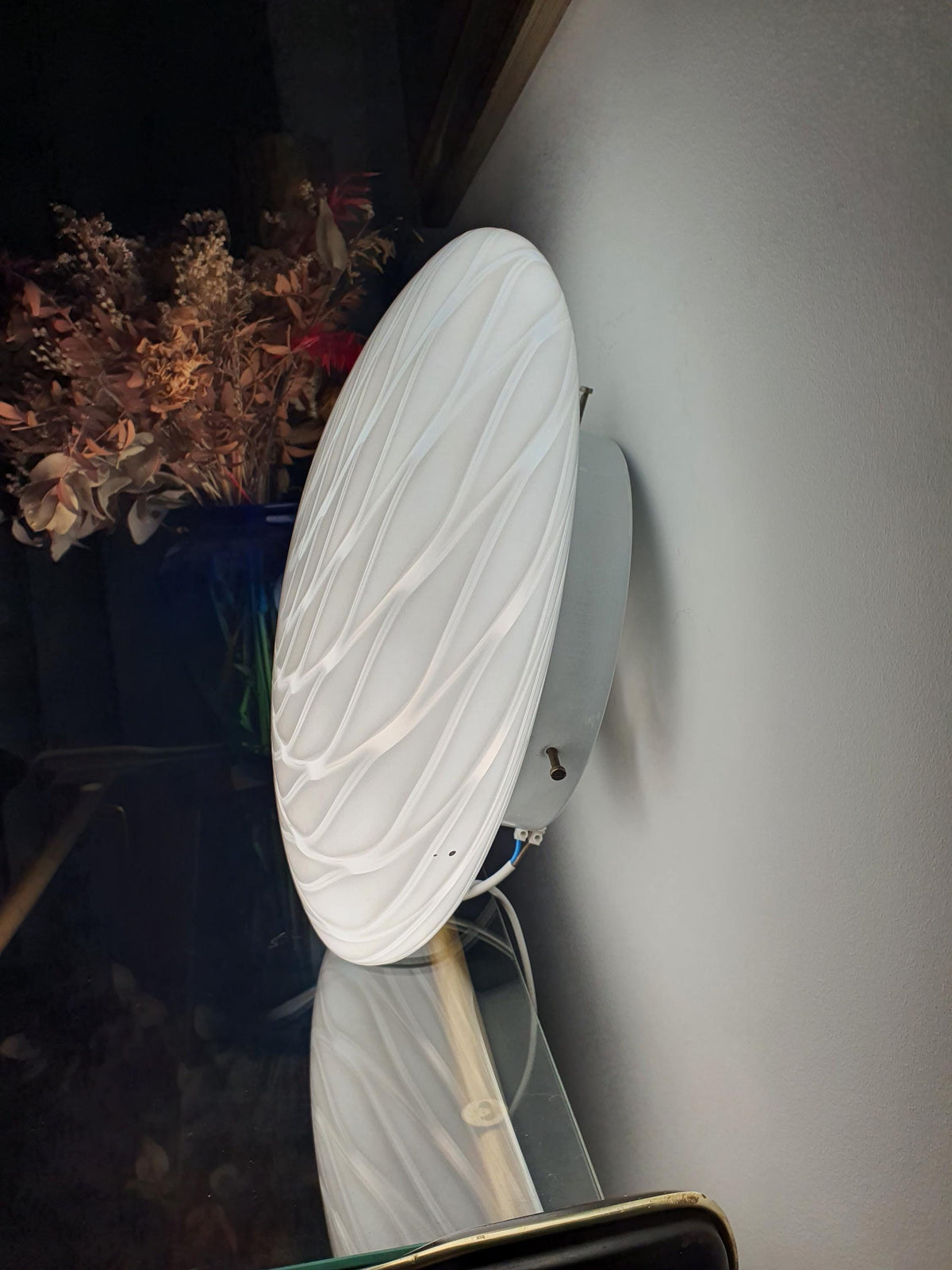 Murano glass flush mount with a rounded white swirl diffuser