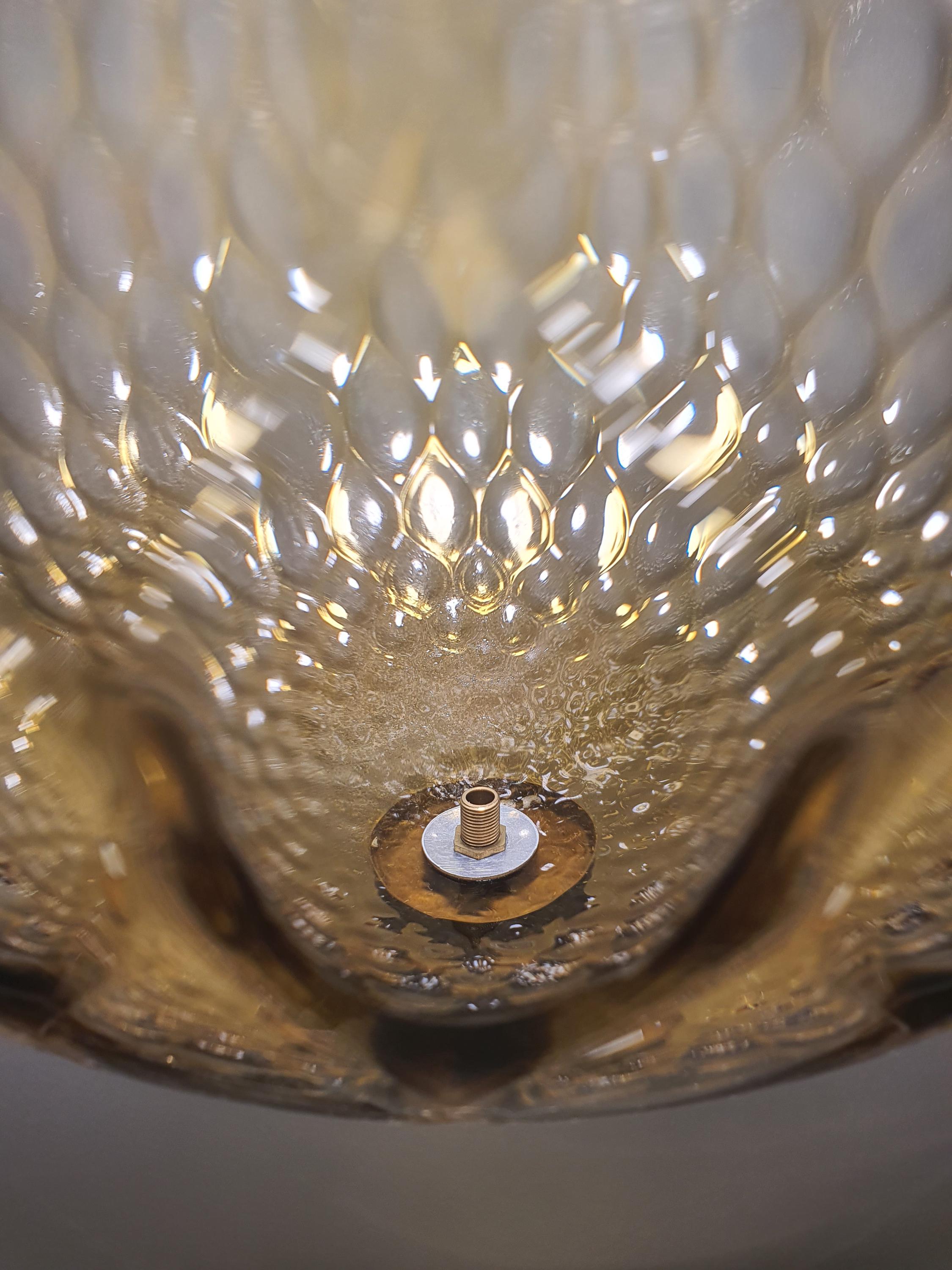 Close-up of caramel honeycomb texture on vintage Murano glass globe shade