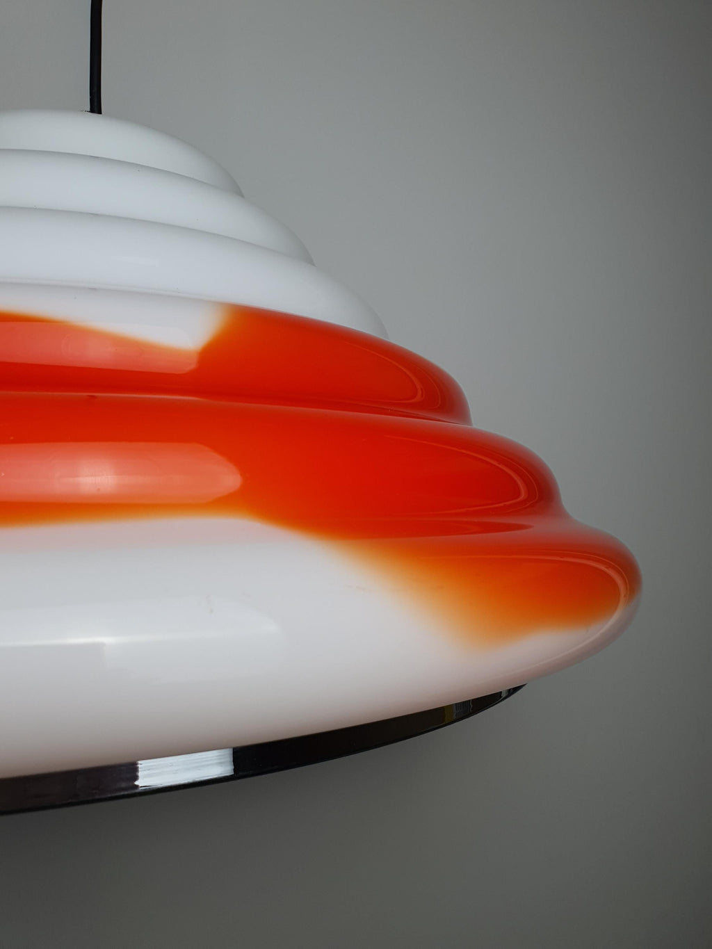 Murano glass Space Age pendant — glossy white exterior and vivid orange spot detail