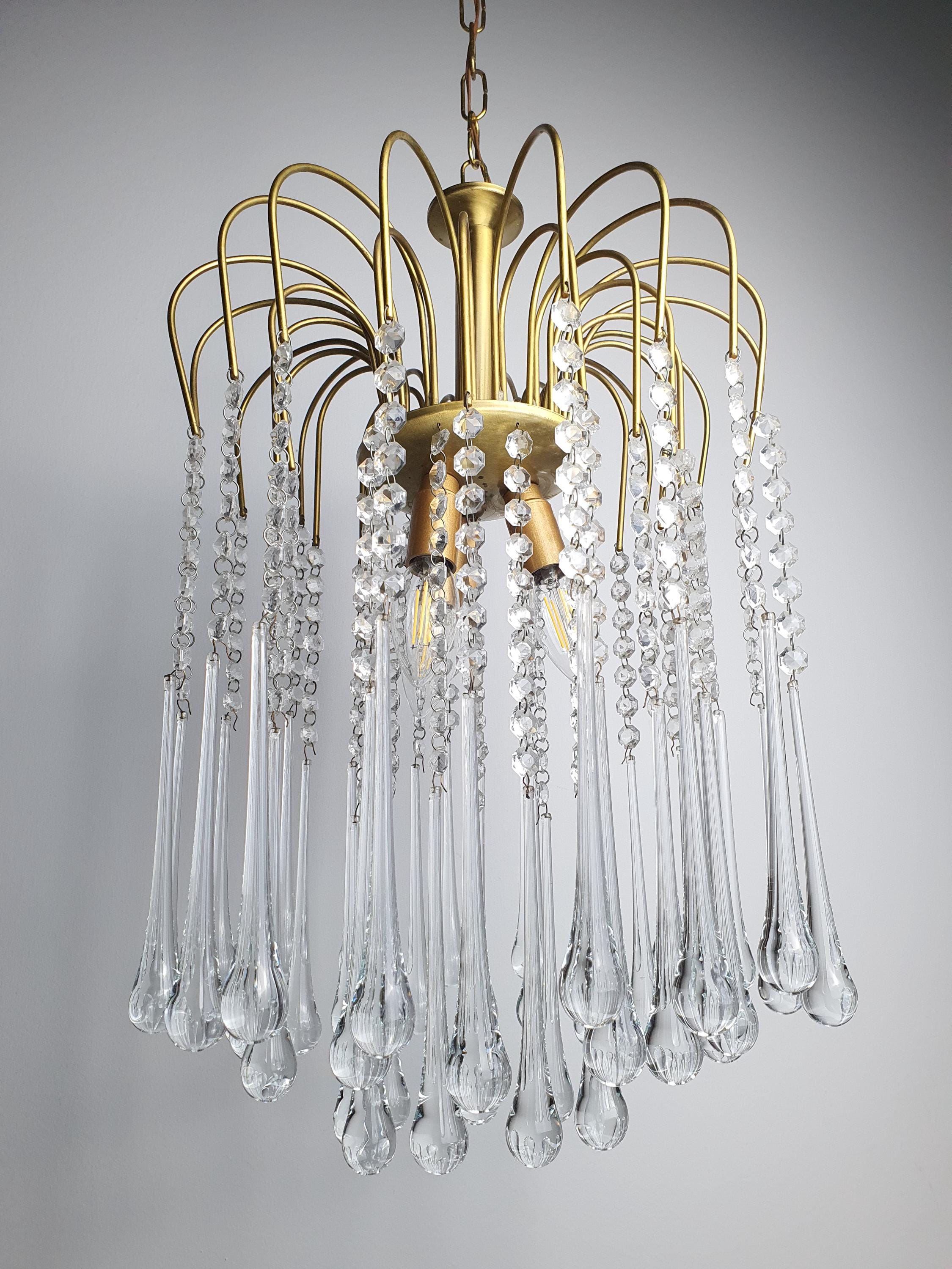 Italian Hollywood Regency chandelier — gold frame and clear glass teardrop composition