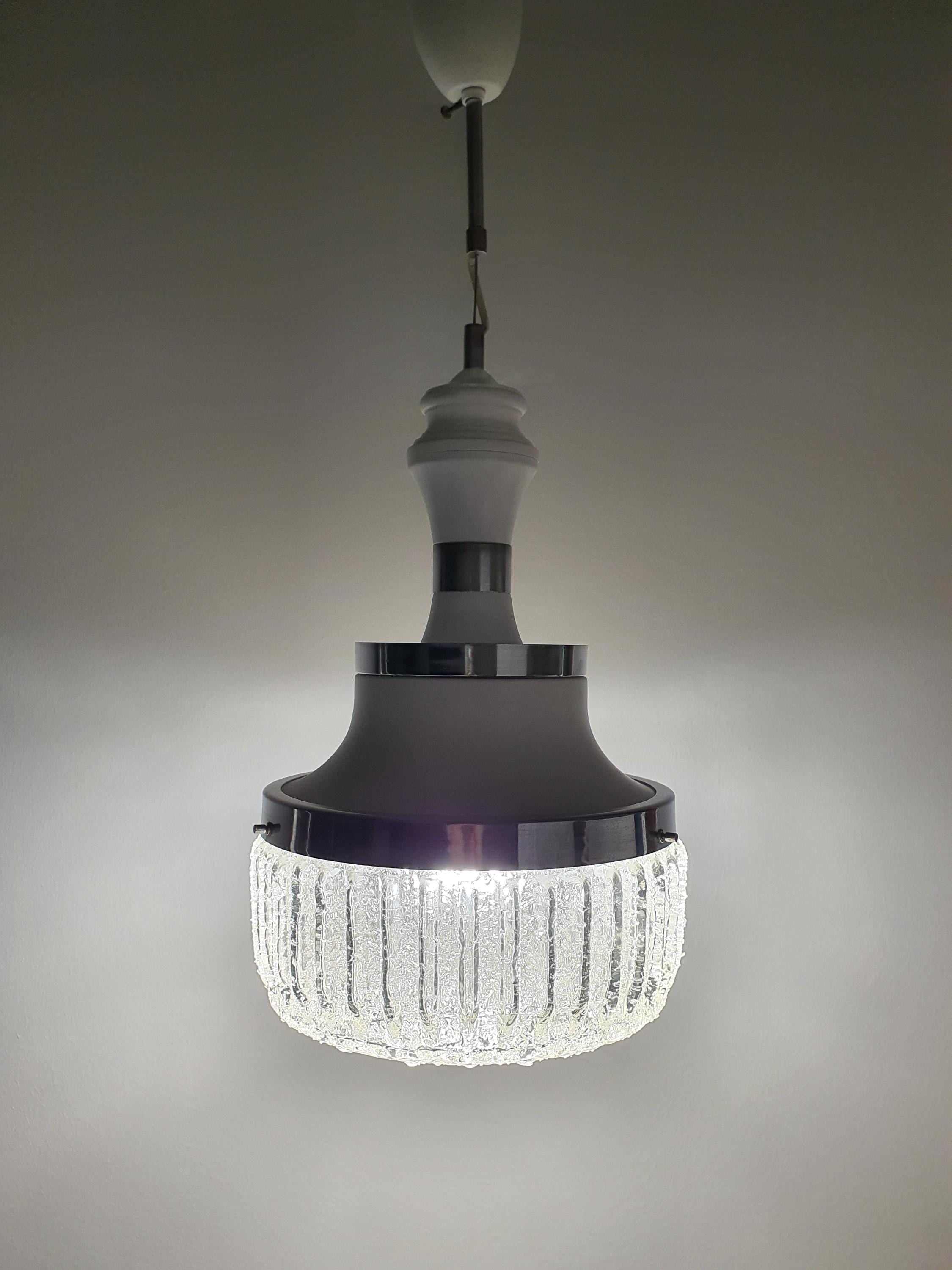 Handcrafted bubbled glass pendant — illuminated, soft diffused glow through frosted section