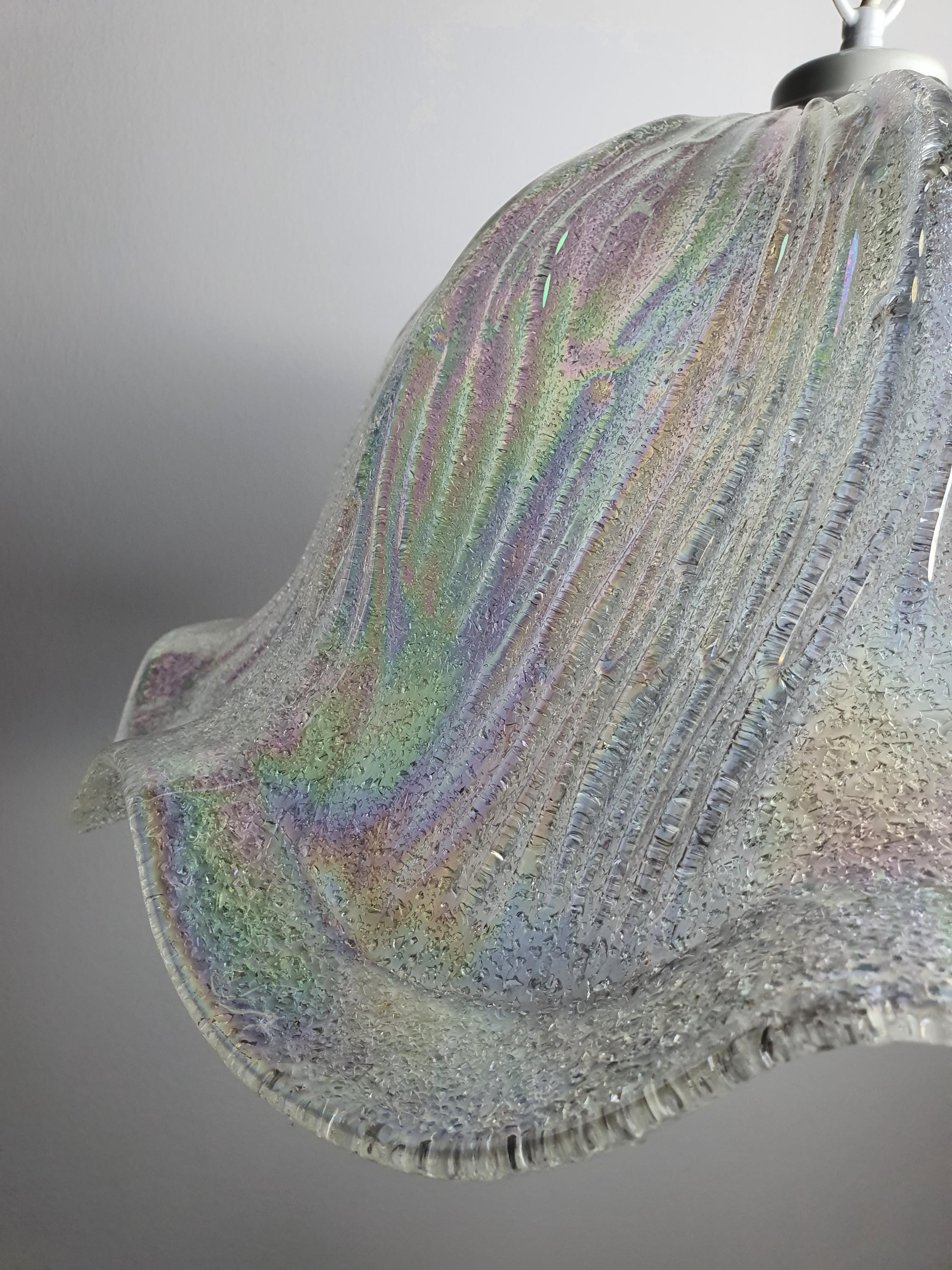 Vintage Murano iridescent tulip pendant lit, ethereal rainbow glow through clear glass, petrol and violet reflections