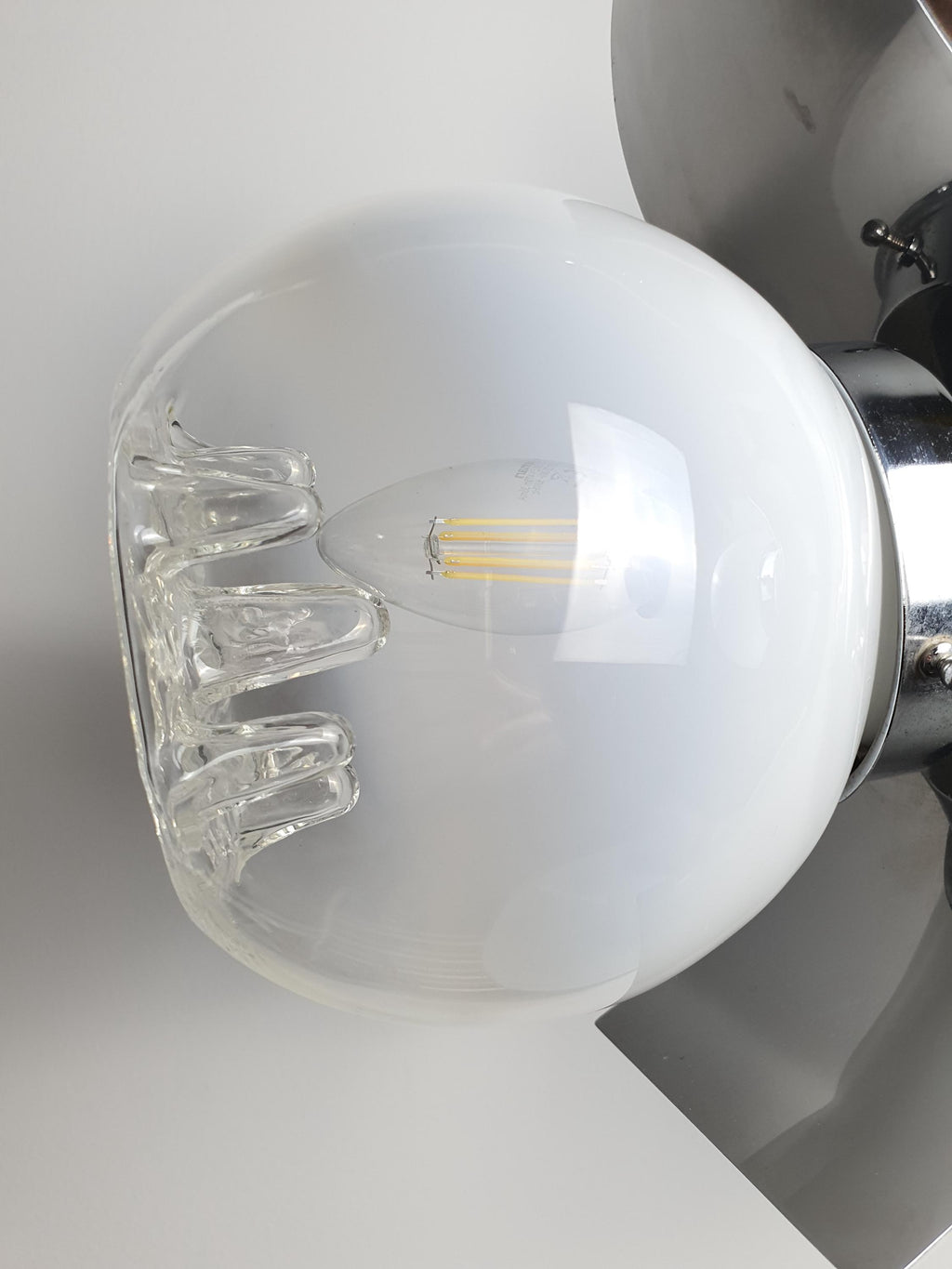 Close-up of white-to-clear gradient Murano glass globe with drop-in relief, Mazzega-style chandelier, 1970s