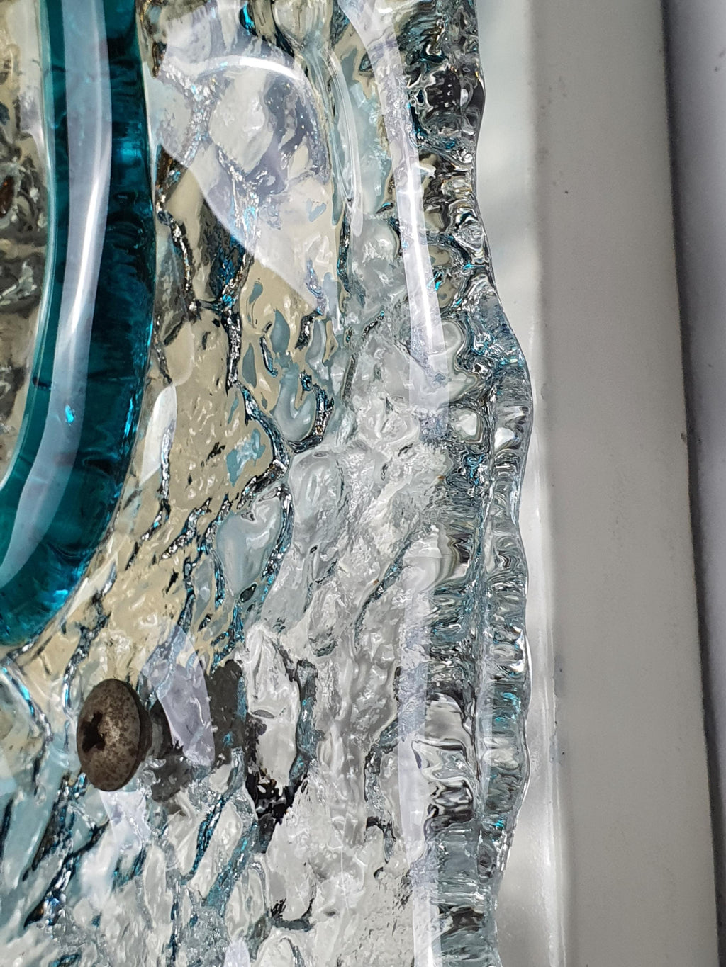 Pair of vintage Mazzega Murano floral sconces lit, warm turquoise caramel light play through thick glass petals