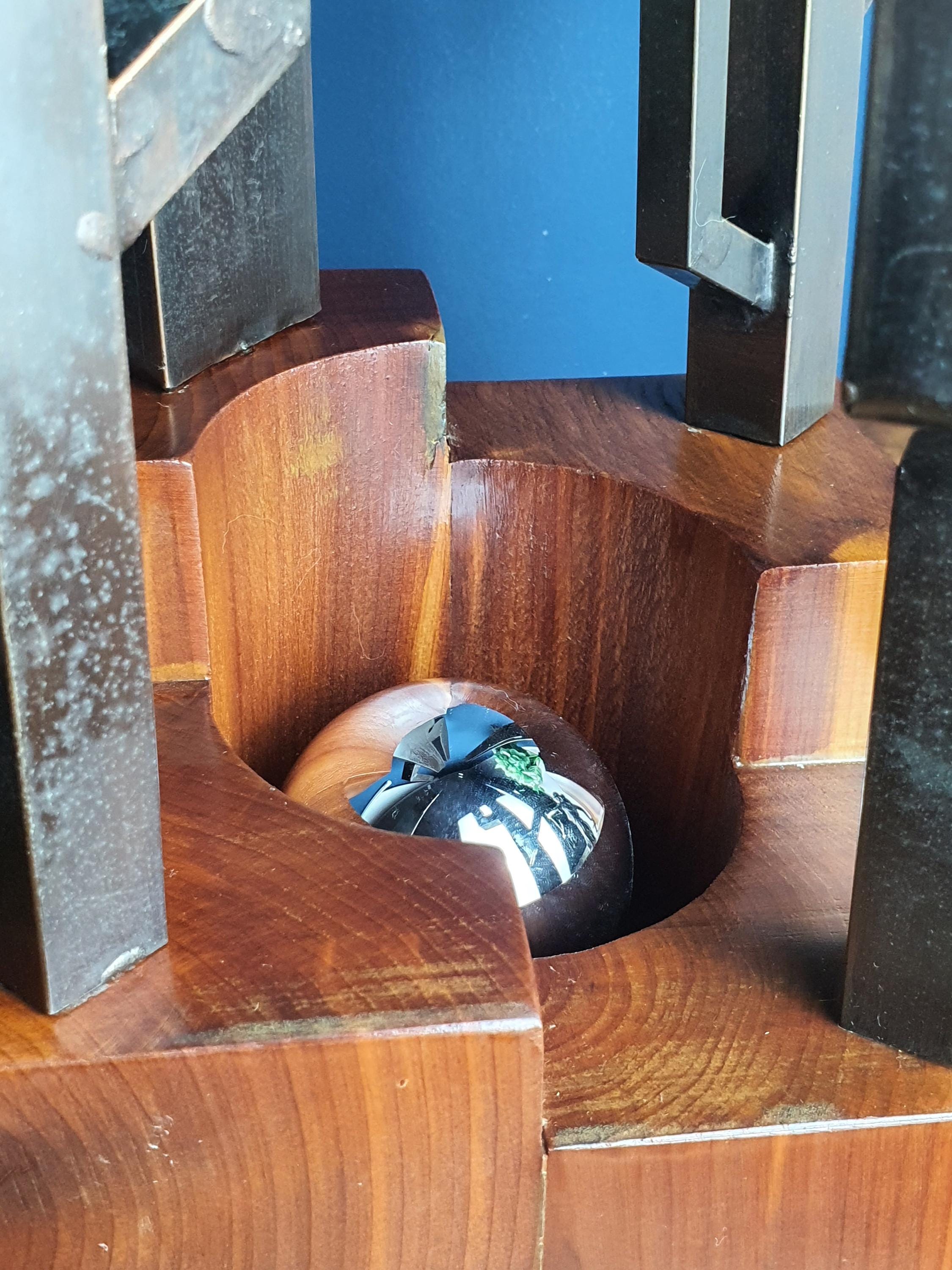 Signed Carlo Italian Brutalist lamp unlit, showing sculptural cactus metal silhouette and wood grain texture