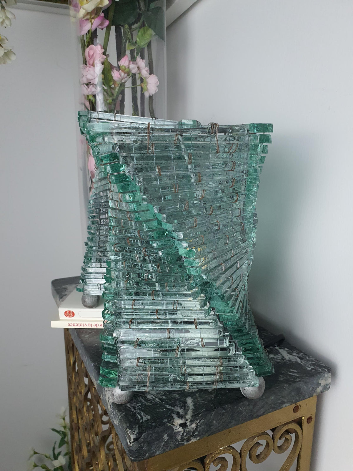 Glass segment edges on a handcrafted recycled glass lamp
