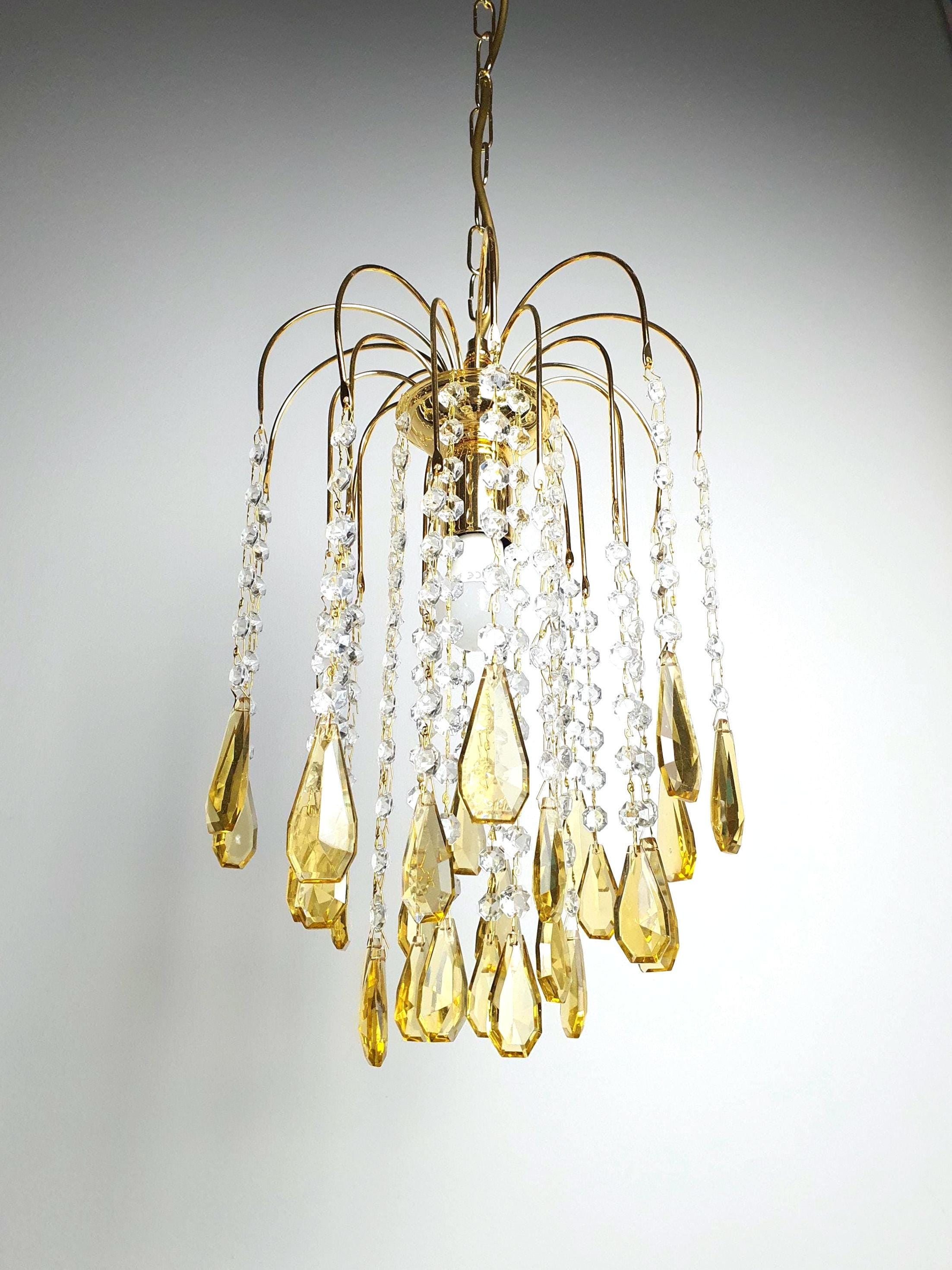 Small vintage honey yellow teardrop chandelier with gold frame in Hollywood Regency style