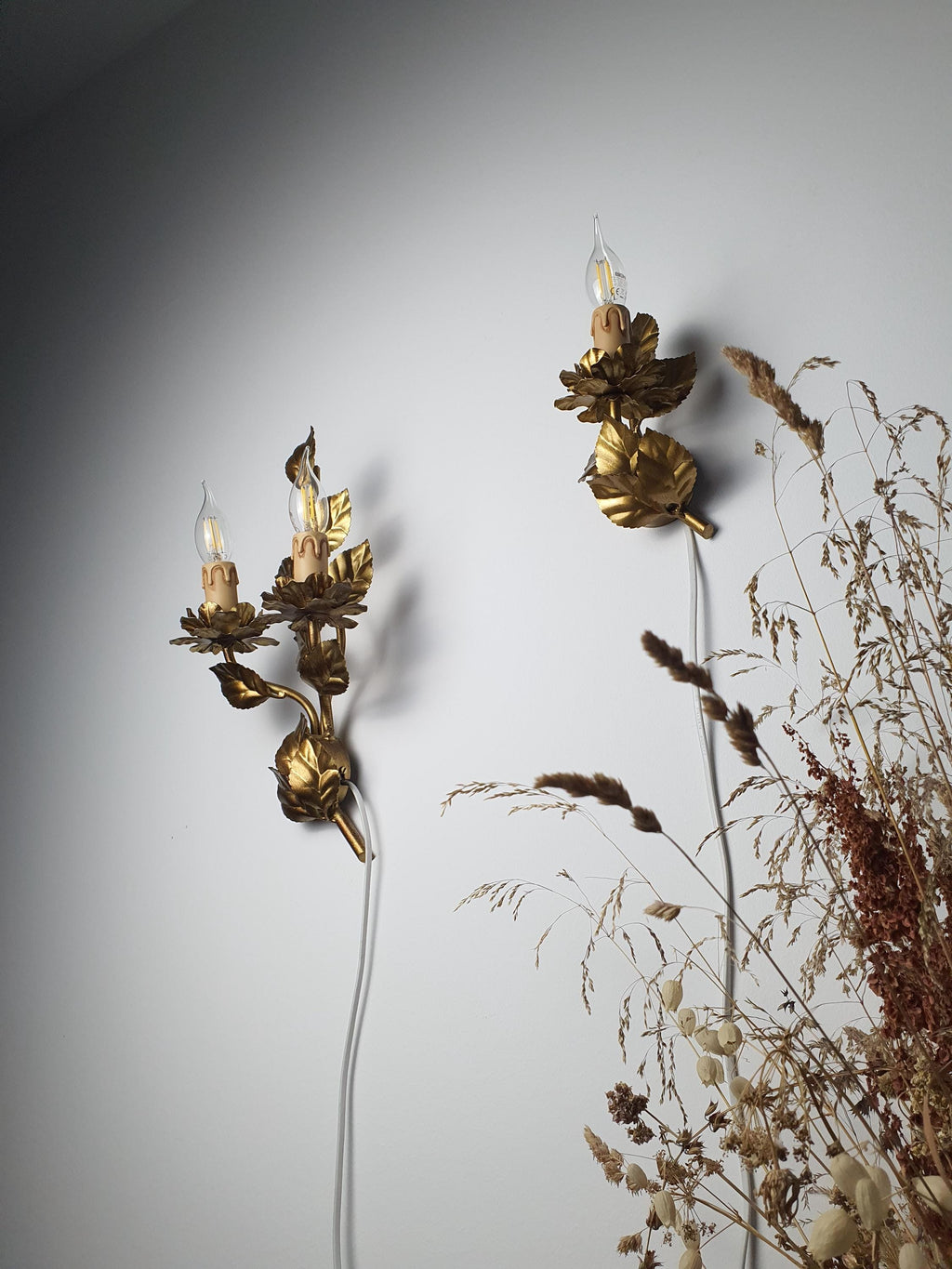 Detail of handcrafted floral metalwork with bronze and golden tones
