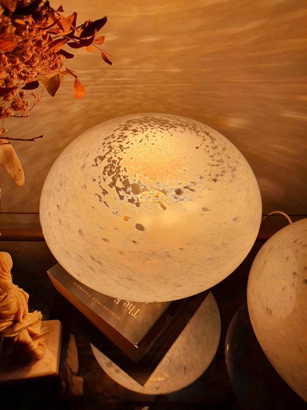 Pair of Vetri di Murano globe lamps on bedside tables, symmetrical matching set, warm ambient glow