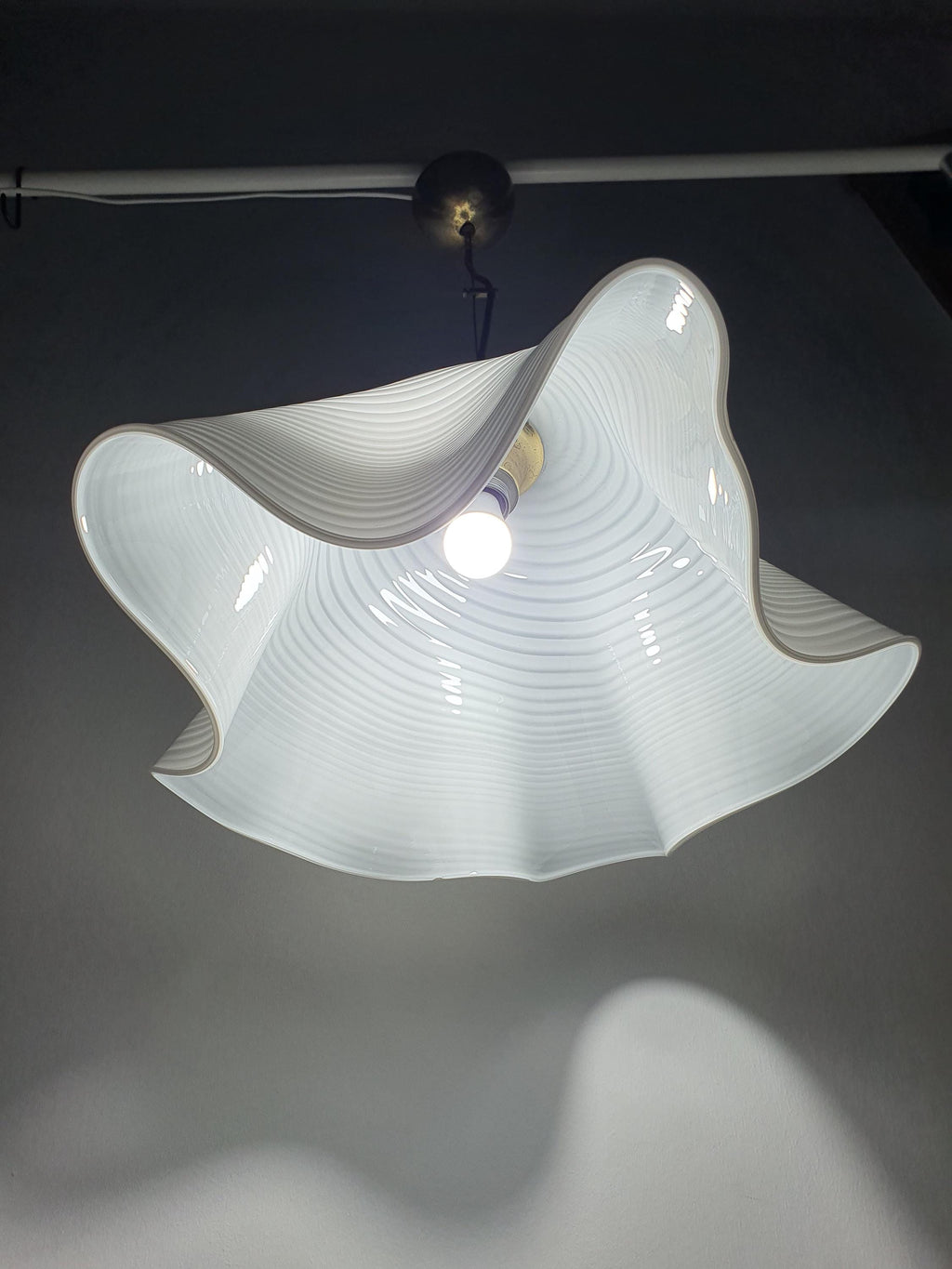 Italian Murano glass fazzoletto pendant — fluid handkerchief form, side profile