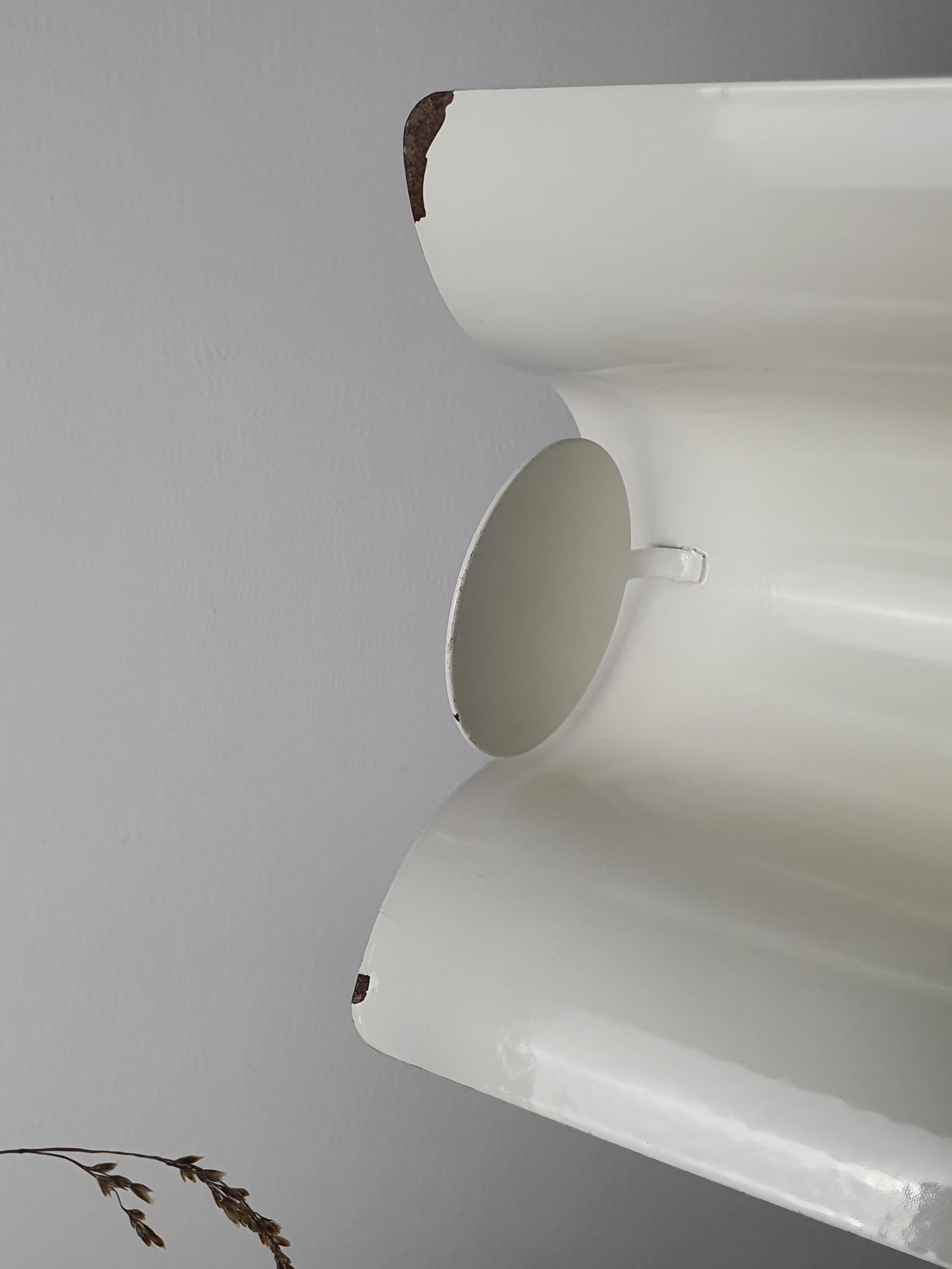 Vintage Italian white floor lamp with visor tilted upward for ambient light, telescopic leg at full height