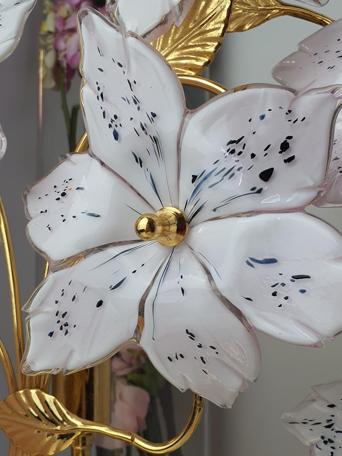 Pink and white glass blossoms on a vintage Italian floral table lamp
