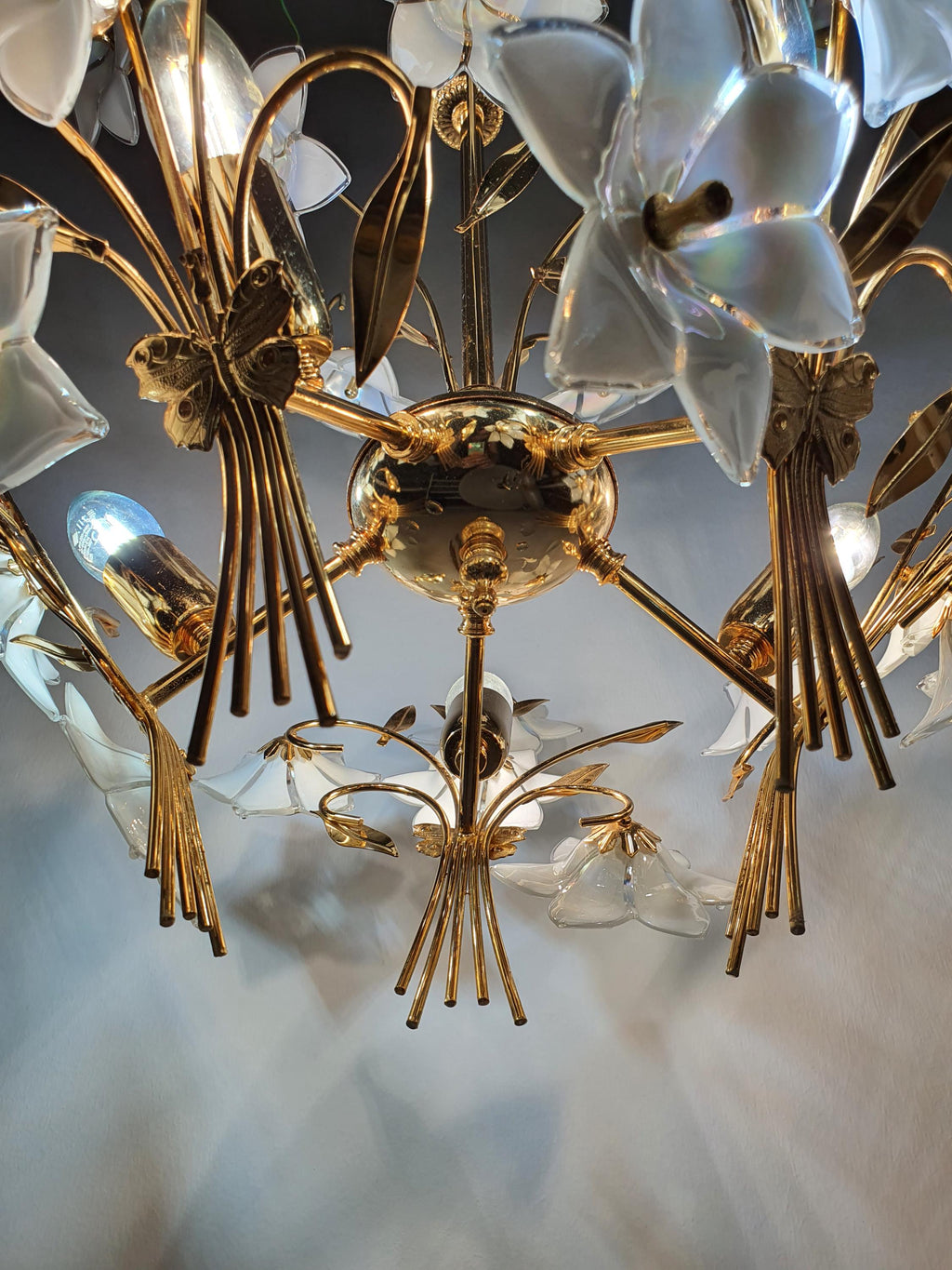 Underside view of vintage Murano glass floral bouquet chandelier, five E14 sockets hidden among white flowers