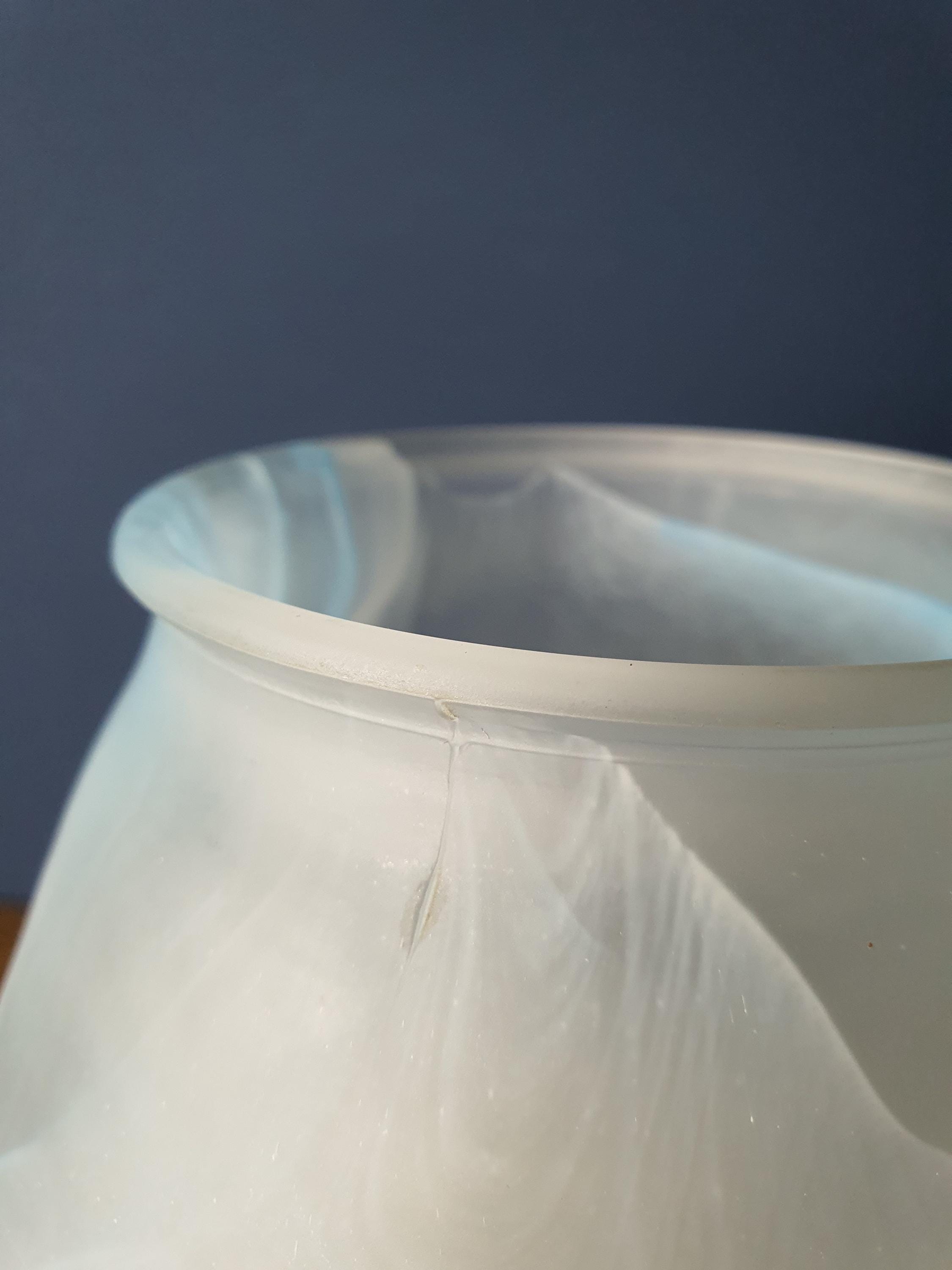 Close-up of blue marbled wave decoration on vintage Due P. satin frosted Murano glass mushroom lamp