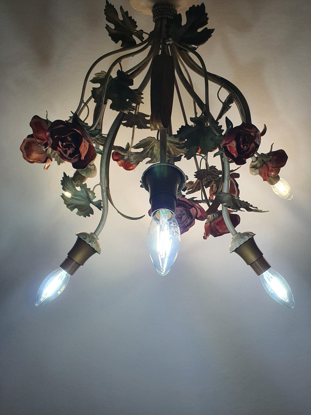 Italian floral tole chandelier — 6 light points illuminated, warm ambient glow
