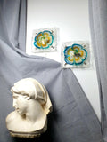 Pair of vintage Mazzega Murano glass floral sconces, turquoise blue caramel amber clear petals, white metal base, Italy 1970s–1980s
