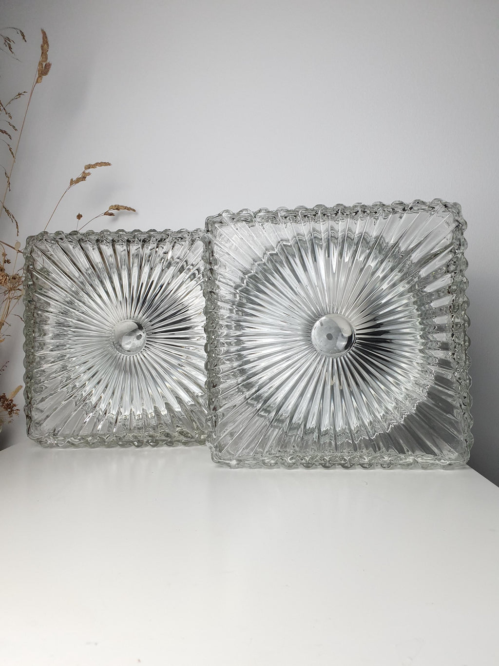 Pair of Brutalist-style sconces with matching square glass forms

