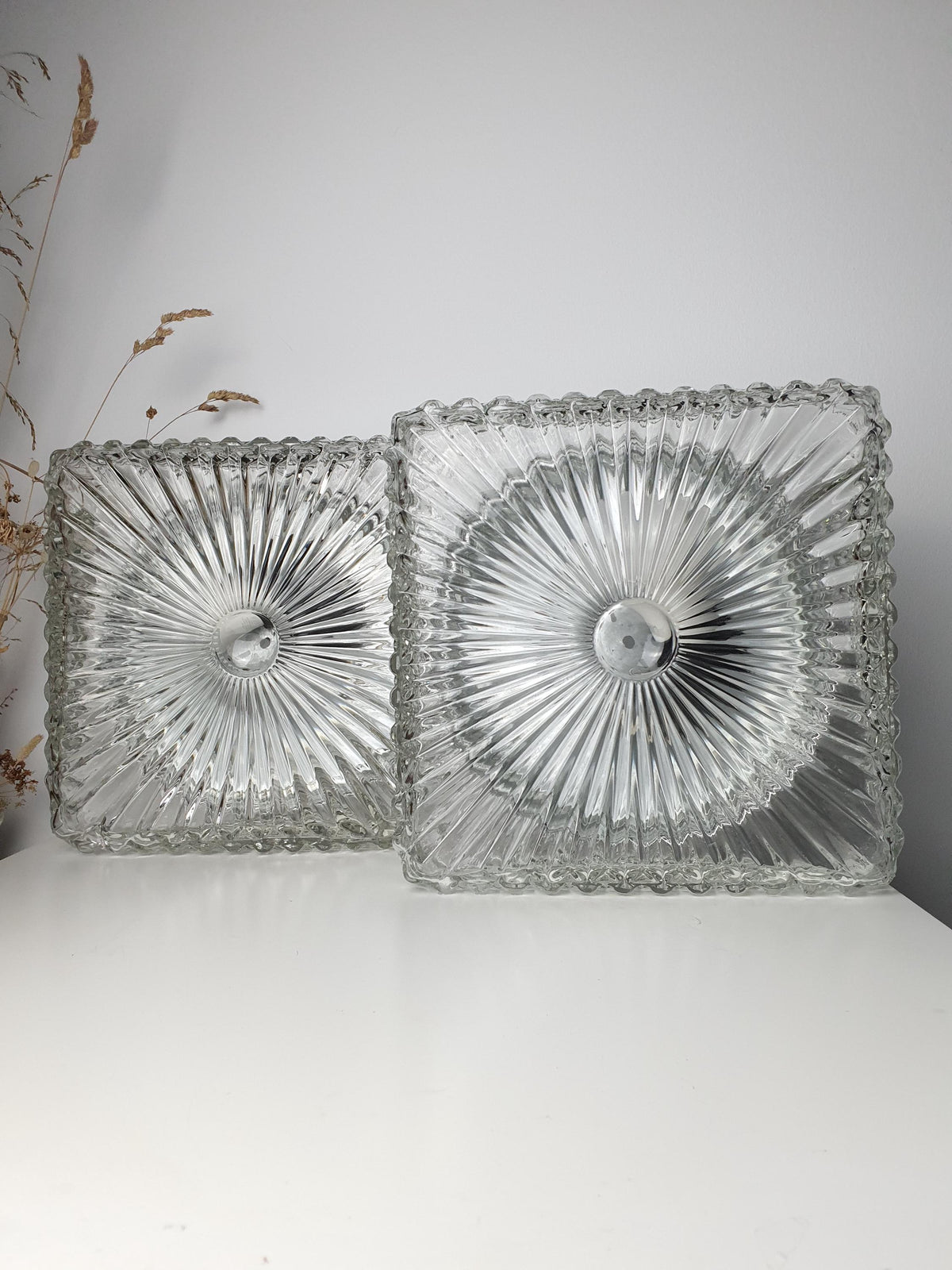 Pair of Brutalist-style sconces with matching square glass forms

