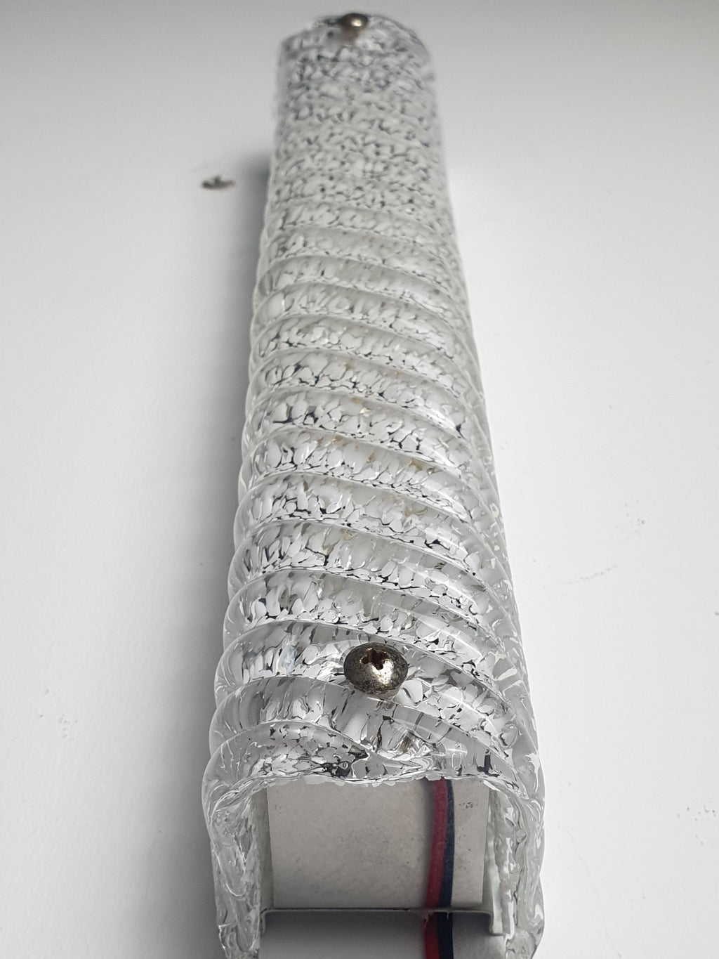 Murano glass ribbed rectangular sconce front view, icy clear with white inclusions, deep vertical ribs, large size