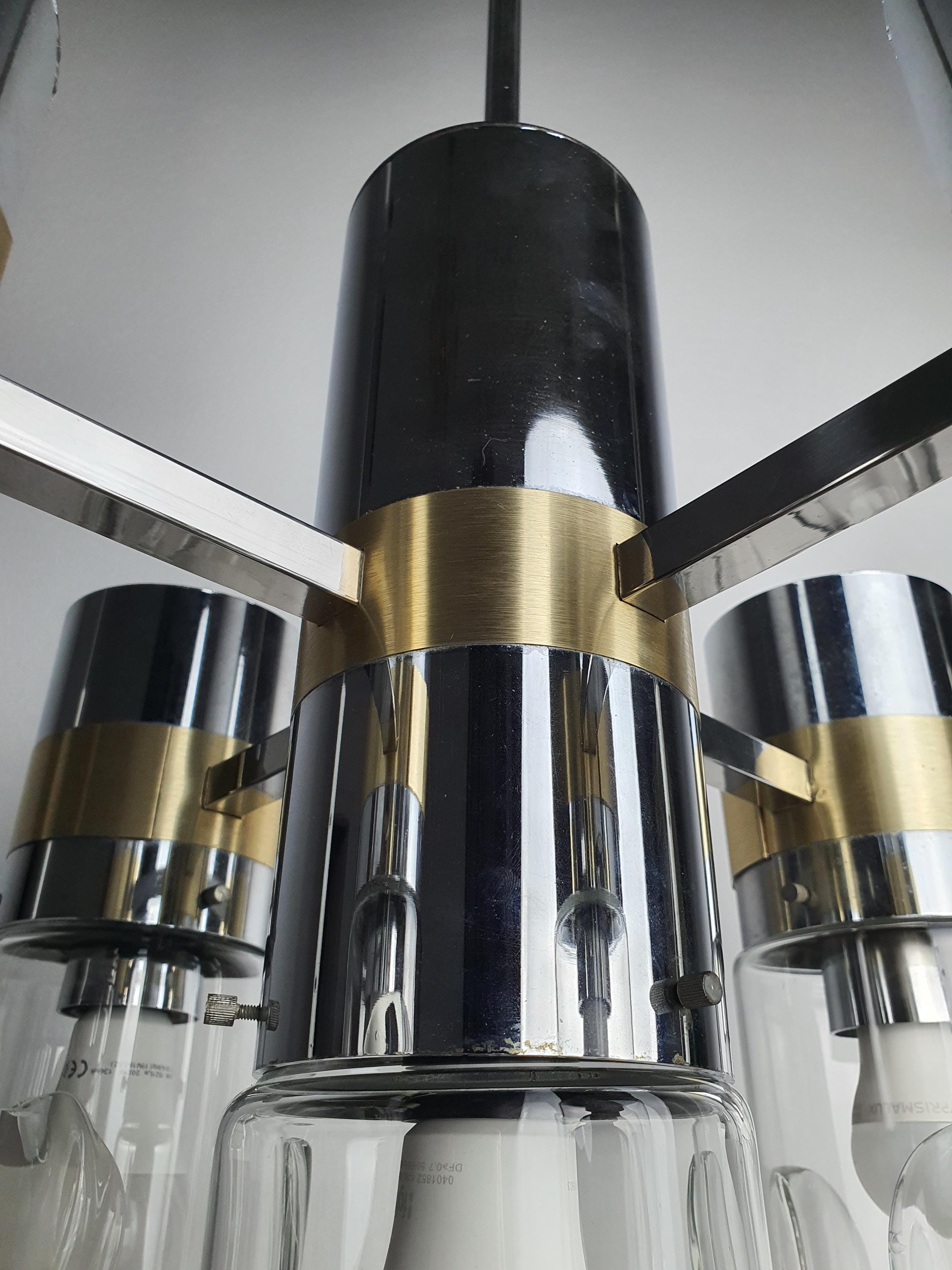 Close-up of chrome and gold-toned metal arm joint on vintage Space Age Sputnik chandelier, Sciolari style, aged patina