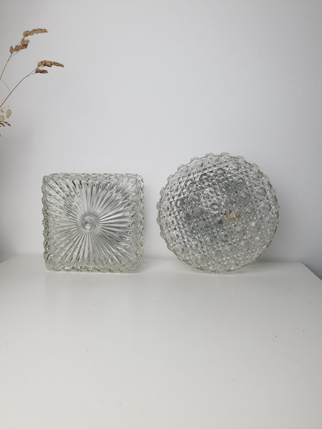 Pair of 1970s Italian glass wall lights in round and square shapes
