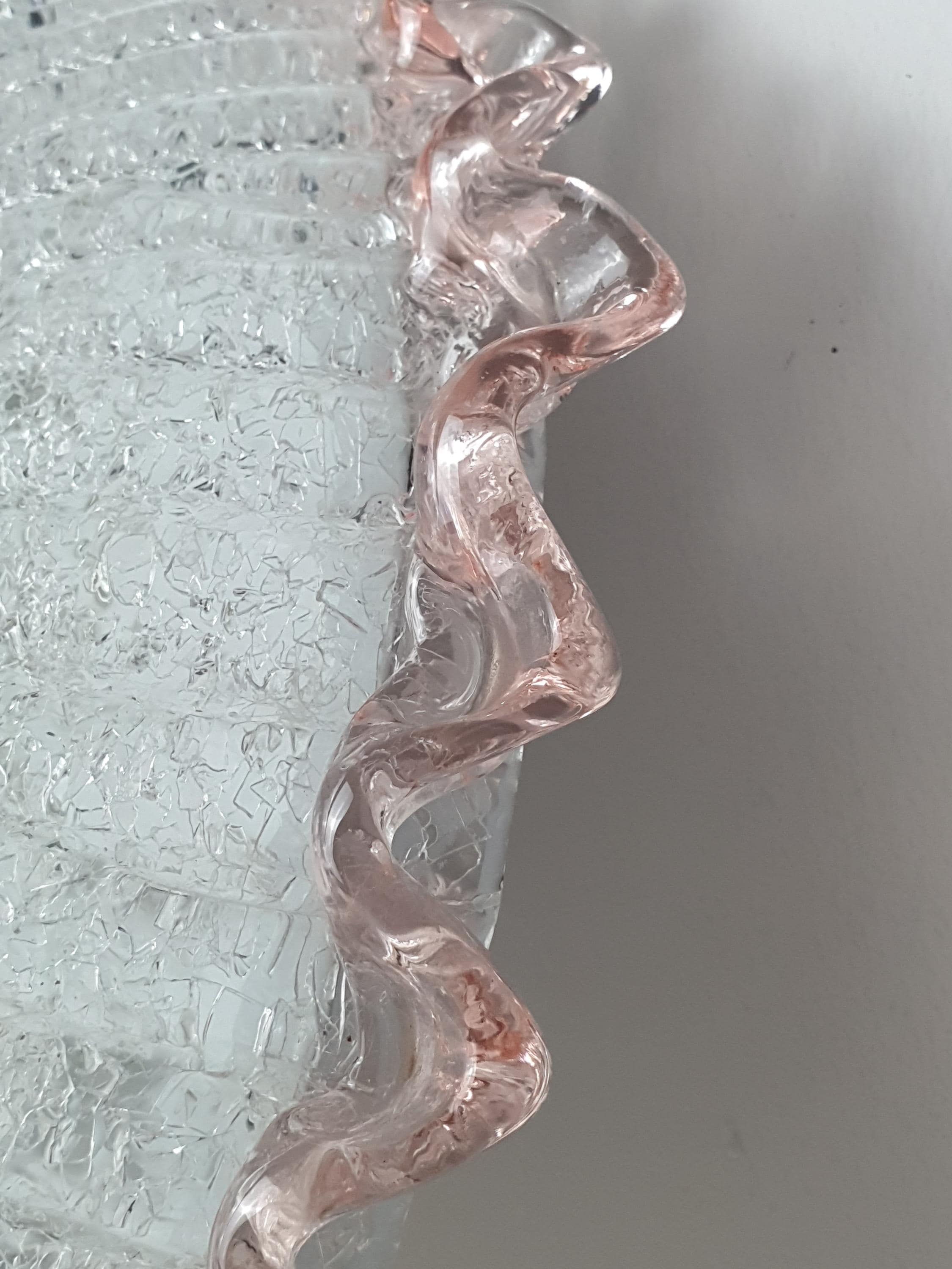 Vintage Murano floral flush mount lit, warm atmospheric glow through frosted graniglia glass, pink rim accent