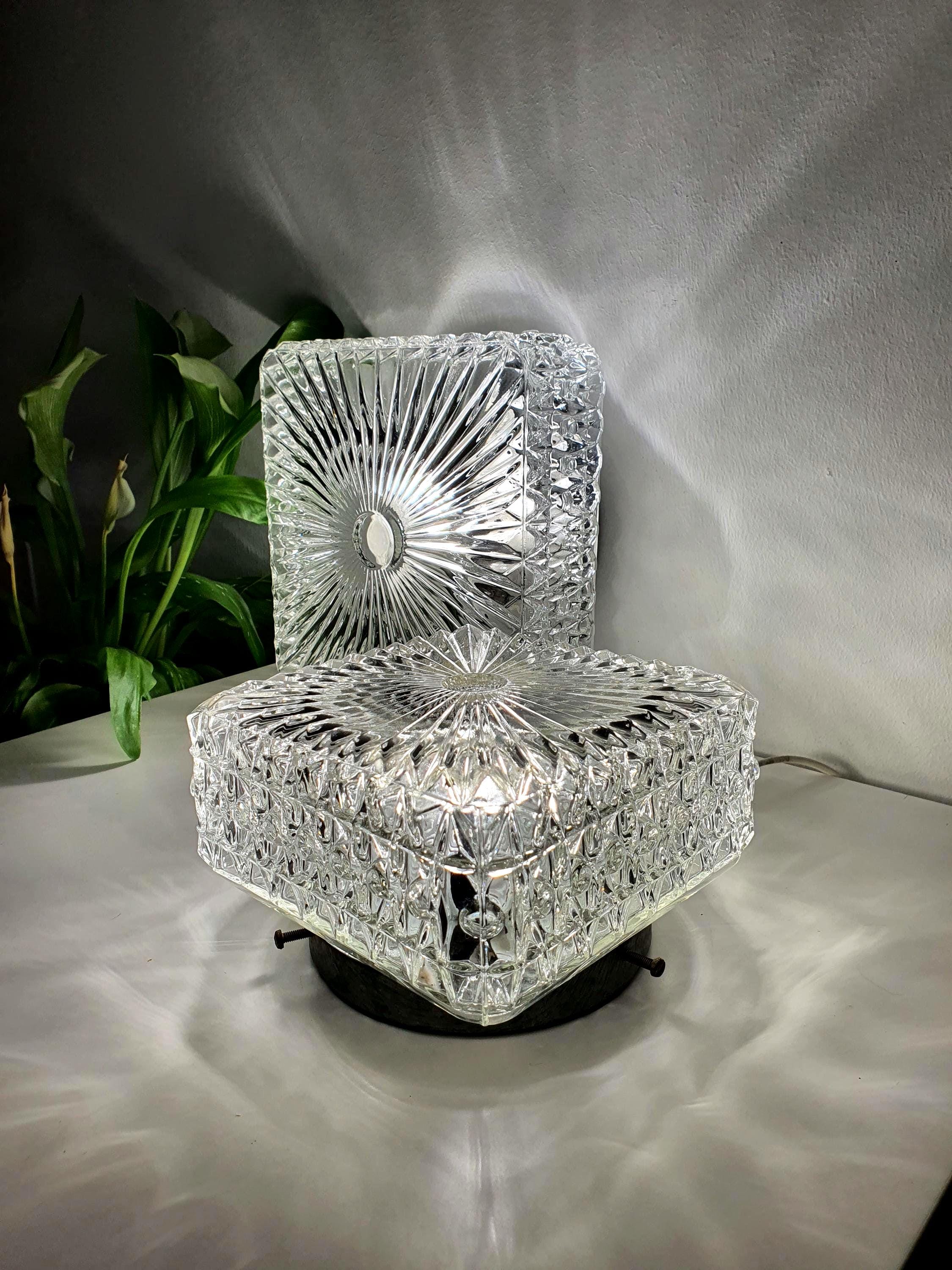 Pair of vintage Prisma Brutalist MCM wall sconces in stamped clear glass"