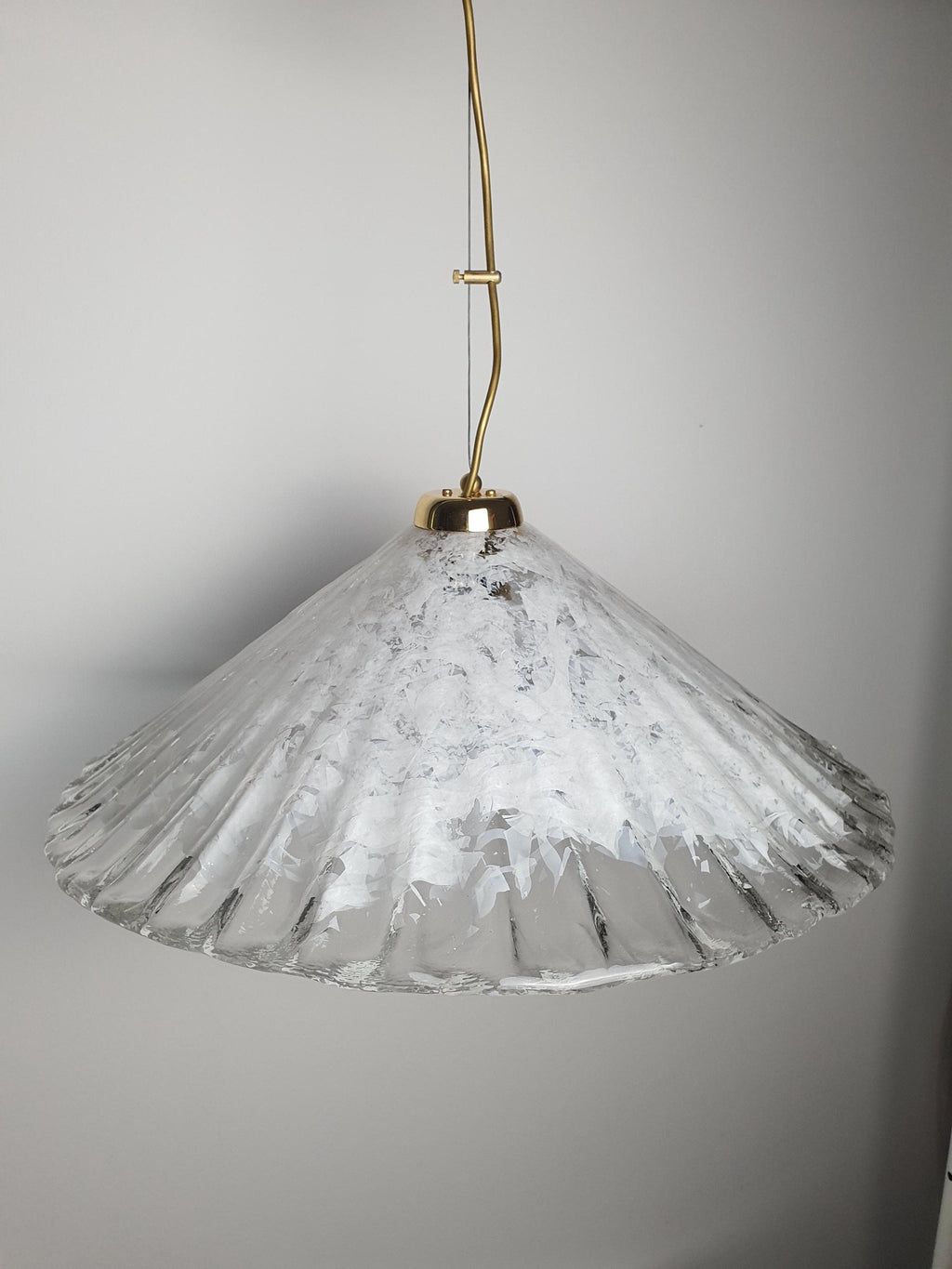 Vintage Italian shell-form Murano glass pendant lit, warm diffused glow through clear and white layered shade