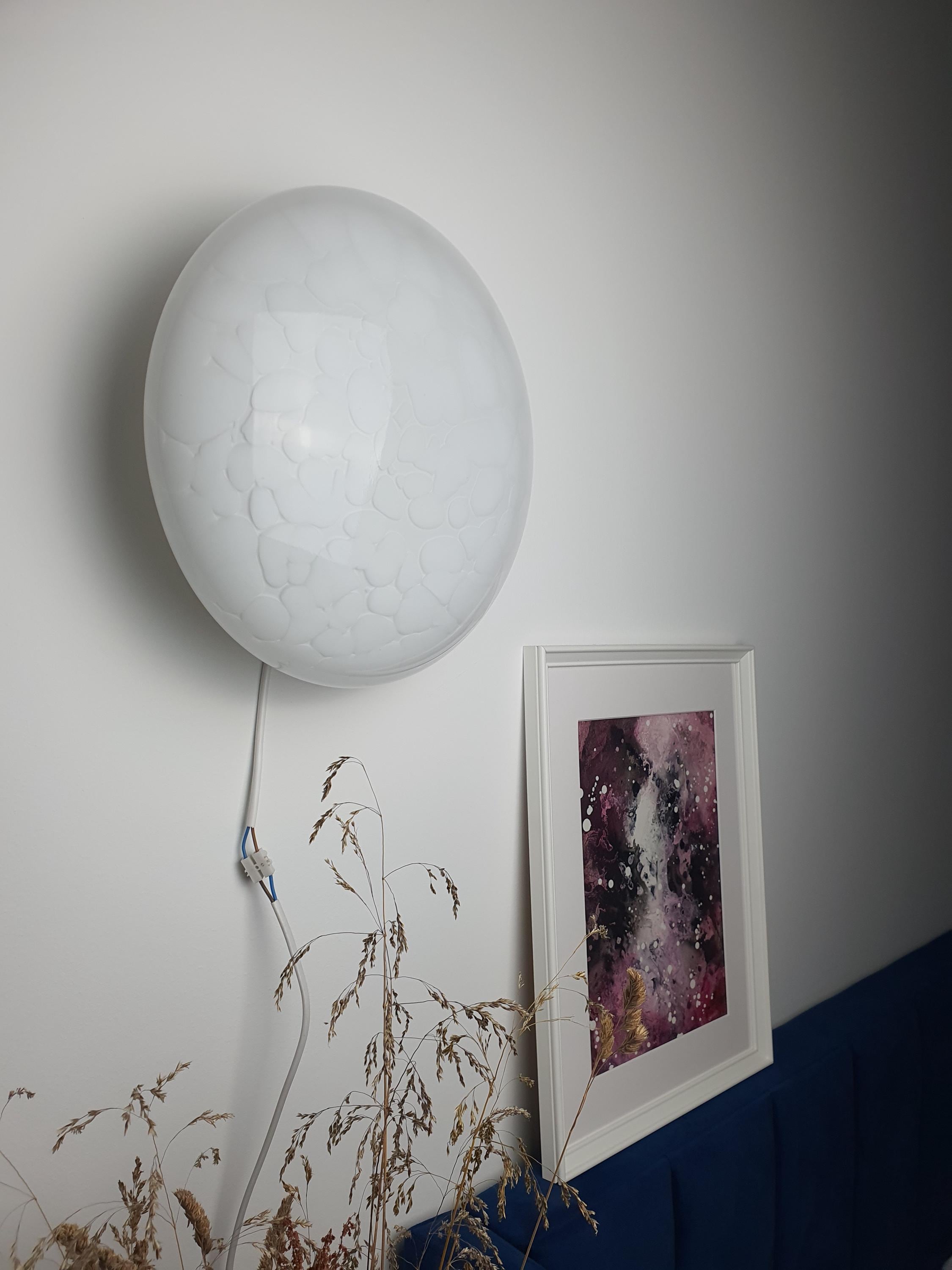 Murano glass wall sconce side profile, layered clear and white spotted glass, clean Scandinavian silhouette