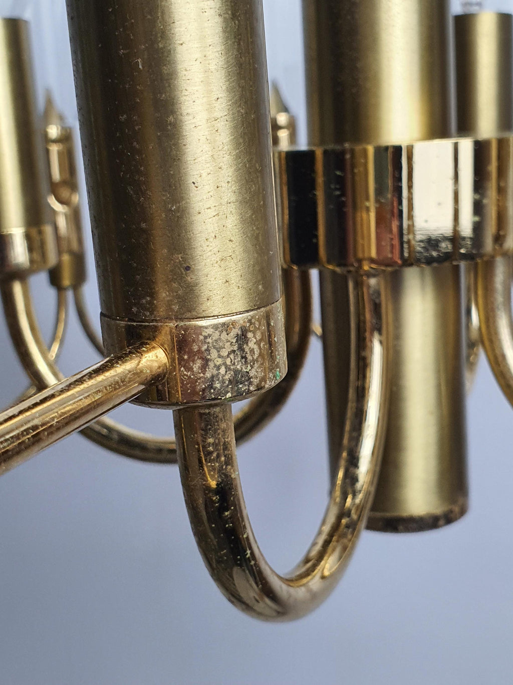Close-up of faceted crystal drops and double-wave brass motif, vintage Sciolari-attributed 4-arm chandelier