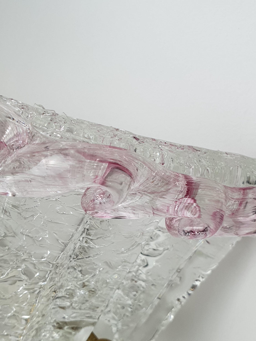 Textured Graniglia ice-glass edge on a vintage floral wall light
