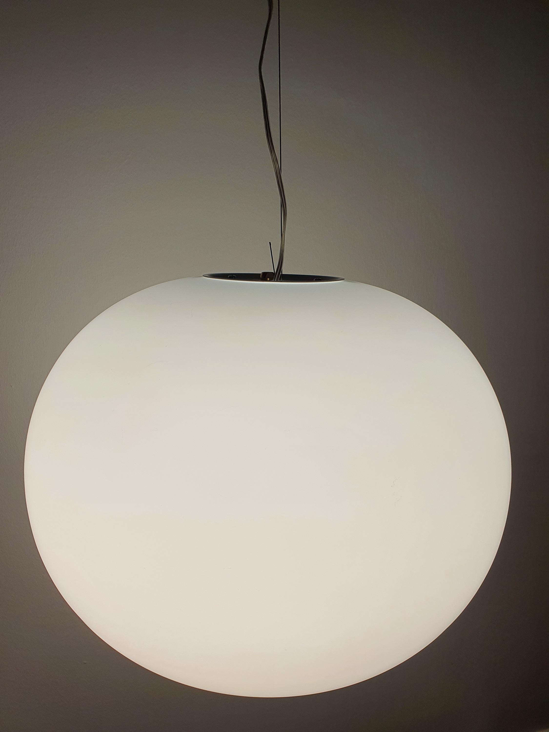 Vintage globe pendant light — satin glass surface detail, even diffused ambient light