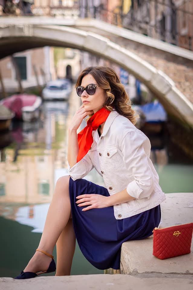 Nadia, founder of Vintage Glass Gems, by a canal in Venice